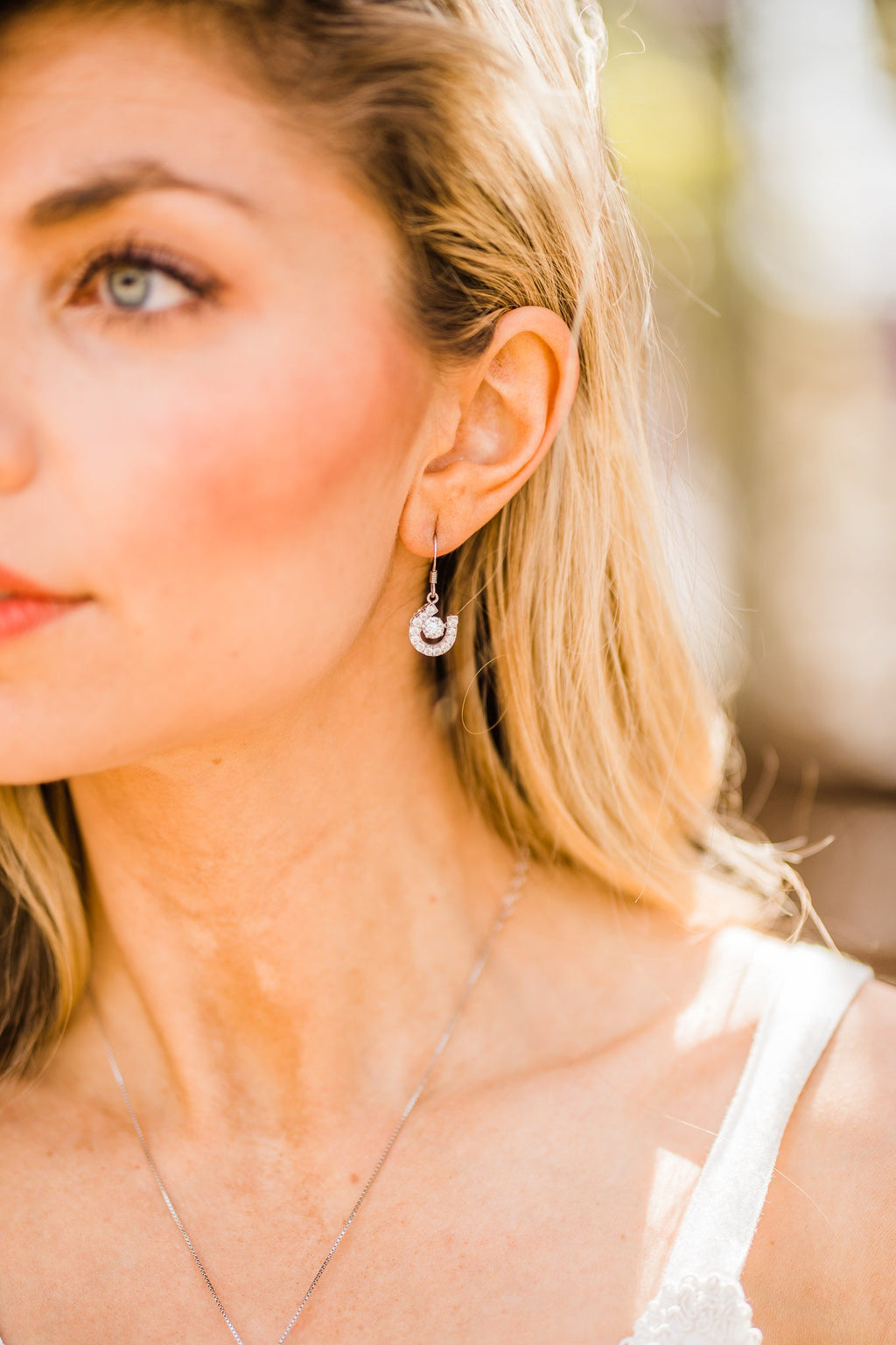 Horseshoe Dancing Stone Dangle Earrings in Sterling Silver
